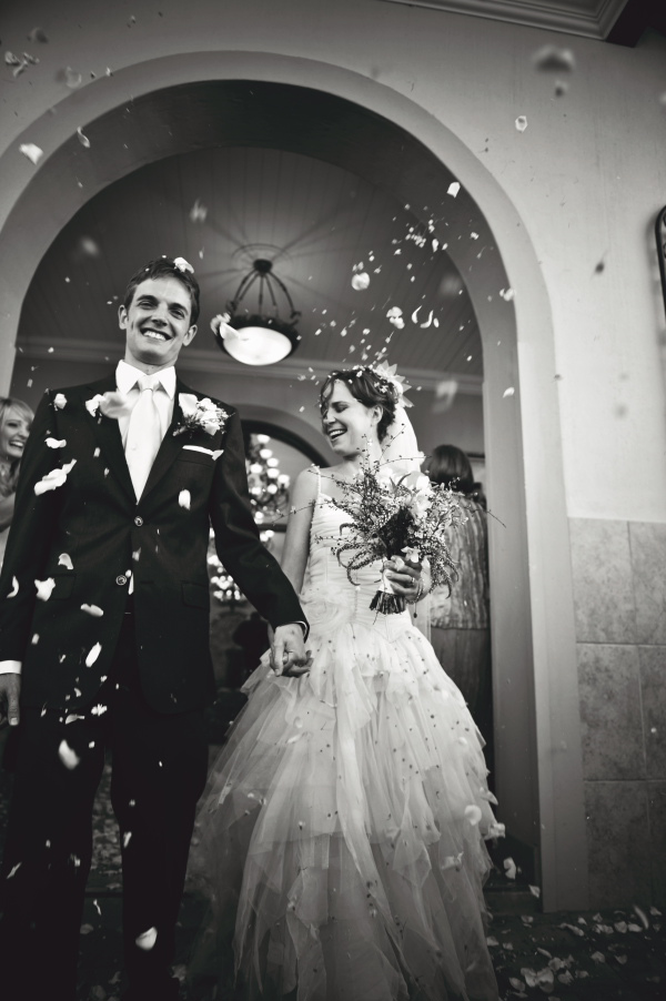 black and white photo of the happy couple leaving ceremony - wedding photo by Australia based wedding photographer Natasha Du Preez